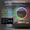 A round LED mirror with RGB lighting and a digital display, mounted on a marble-tiled wall above a sink. Anteprima dell’immagine prodotto