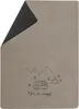 A folded blanket with a camping scene illustration and text. Produktbild-Vorschau