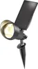 A black solar-powered spotlight with a solar panel attached, mounted on a ground stake. Produktbild-Vorschau