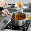 A person is making caramel in a pot on an induction stove, with a digital thermometer attached to the pot. Náhľad obrázku produktu