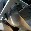 Close-up of a circular saw blade cutting into a piece of wood. Produktbild-Vorschau