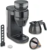 A Severin filter coffee machine with its accessories, including a carafe and a filter basket, displayed on a white background. Produktbild-Vorschau