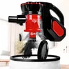 A close-up shot of a black and red handheld vacuum cleaner, with dust being expelled into a white trash bag. Produktbild-Vorschau