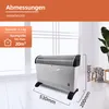 A white and black convector heater is shown in a room with a window and a plant in the background. Dimensions are indicated. Produktbild-Vorschau