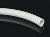 A flexible white corrugated tube is shown against a black reflective background. Náhled obrázku produktu