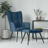 A blue velvet armchair and ottoman set in a minimalist room setting. Voir les images du produit