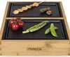 A tabletop grill with food items on its cooking surfaces. Produktbild-Vorschau