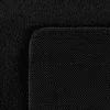 A close-up view of a black rug, showing the texture of the fabric and the backing. Podgląd zdjęcia produktu