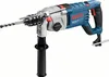 A Bosch rotary hammer drill with a side handle and drill bit, shown against a white background. Voir les images du produit