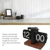 A desk with a clock and other decorative items. Náhled obrázku produktu