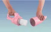 Two hands are holding parts of a pink handheld vacuum cleaner against a light blue background. Podgląd zdjęcia produktu