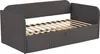 A gray upholstered daybed with a slatted wooden base and two drawers underneath, shown from a three-quarter angle against a white background. Anteprima dell’immagine prodotto