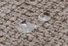 Close-up of two water droplets on a textured carpet. Produktbild-Vorschau
