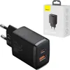 A black Baseus compact quick charger with two USB-C ports is shown next to its packaging. Produktbild-Vorschau