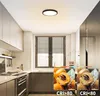 A modern kitchen with a ceiling light fixture and two comparative images of fruit. Produktbild-Vorschau