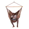 A man is relaxing in a brown hammock chair, holding a drink. Produktbild-Vorschau