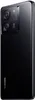 A black Xiaomi 13T Pro smartphone is shown from a side angle, highlighting its camera module and the Xiaomi logo. Podgląd zdjęcia produktu
