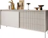 A modern, beige sideboard with fluted doors and drawers, decorated with various objects on top. Produktbild-Vorschau