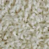 A close-up view of a cream-colored shaggy carpet. Produktbild-Vorschau
