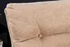Close-up of a tufted chair cushion with a button detail. Produktbild-Vorschau