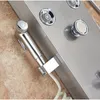 A close-up view of a modern stainless steel shower panel with a handheld bidet sprayer and several control knobs. Náhľad obrázku produktu