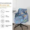 A blue blanket with dinosaur patterns is draped over an office chair. Produktbild-Vorschau