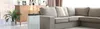 An air purifier is placed in a living room next to a sofa and a wooden cabinet. Produktbild-Vorschau