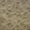 A close-up view of sand with ripples and shadows. Náhled obrázku produktu