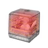 A transparent dishwasher with dishes inside, highlighted with red and orange to indicate heat or operation. Produktbild-Vorschau