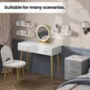 A vanity set with shelves, mirror, and chair in a room. Produktbild-Vorschau