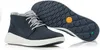 A pair of navy blue Timberland boots with white soles are shown against a white background. Produktbild-Vorschau