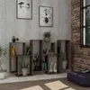 A modern living room with a bookshelf filled with books and decorative items. Náhled obrázku produktu