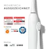 A white electric toothbrush with a brush head, surrounded by marketing badges and text. Náhled obrázku produktu