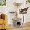 A cat is playing on a multi-level cat tree in a living room setting, next to a yellow sofa. Produktbild-Vorschau