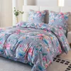 A neatly made bed with floral patterned bedding. Produktbild-Vorschau