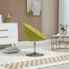 A lime green swivel chair is placed on a rug in a room with a white dresser and a round coffee table. Produktbild-Vorschau