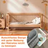 A nursery room with a wooden crib and bedding, with a close-up inset showing a product detail. Produktbild-Vorschau