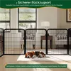 A dog is sleeping inside a black metal pet playpen set up in a living room. Podgląd zdjęcia produktu
