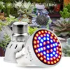 Two LED grow lights are shown in front of a miniature garden scene with succulents and a small house. Produktbild-Vorschau