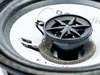 A close-up view of a car speaker tweeter and part of the woofer cone. Produktbild-Vorschau