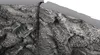 A close-up view of a textured, stone-like material, likely a decorative panel or insert. Anteprima dell’immagine prodotto