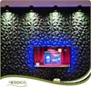 A television displaying content is mounted on a wall covered with 3D wall panels. The panels are illuminated by spotlights and LED lighting. Podgląd zdjęcia produktu