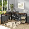 A corner desk with a laptop, chair, and decorative items in a room with a window. Produktbild-Vorschau