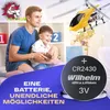A father and son playing with a toy helicopter indoors, with a battery shown in the foreground. Produktbild-Vorschau