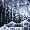 A house decorated with white icicle lights for Christmas. Produktbild-Vorschau