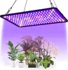 A grow light illuminates a collection of potted plants. Náhľad obrázku produktu