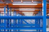 Rows of industrial shelving in a warehouse. Produktbild-Vorschau