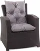 A black rattan armchair with gray cushions. Produktbild-Vorschau