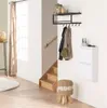 A hallway or entryway with a shoe cabinet, coat rack, stairs, and a stool. Podgląd zdjęcia produktu