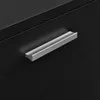A close-up of a black cabinet with a silver handle. Náhled obrázku produktu